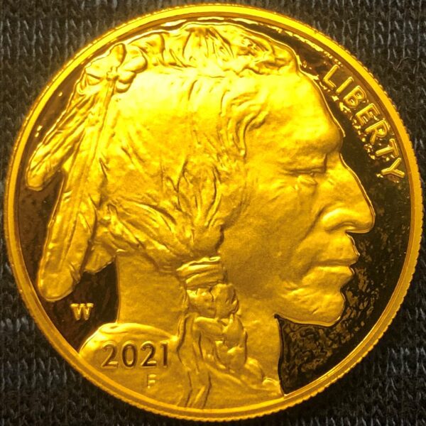 A gold coin with an indian head on it.