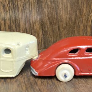 A red car and white car are on the table.