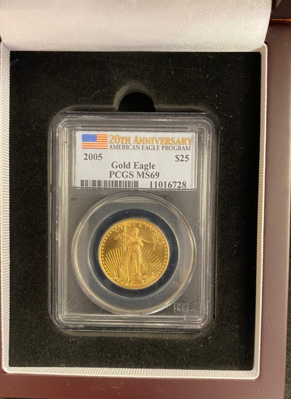 A gold eagle coin is in its case.
