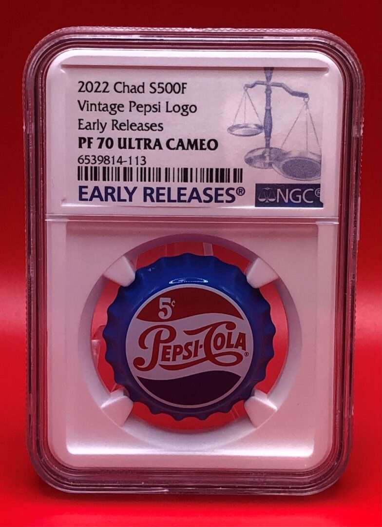 A PEPSI COLA LOGO SILVER VINTAGE BOTTLE CAP - PF 70 EARLY RELEASE with a prominent logo.