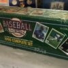 A box of baseball cards sitting on top of a table.