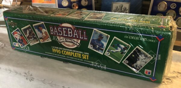 A box of baseball cards sitting on top of a table.