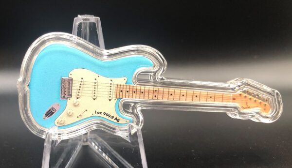 A blue plastic guitar with a clear stand.