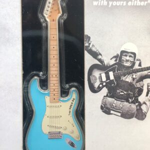 A blue fender guitar in a box.