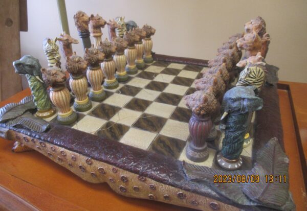 A chess board with many different colored pieces.