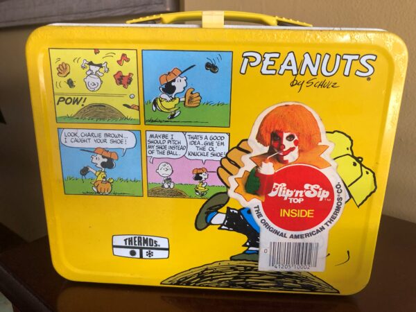 A lunch box with peanuts on it