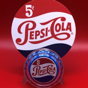 A colorized PEPSI COLA BOTTLE CAP - 0.999 FINE SILVER, COLORIZED & Encapsulated sign on a red background.