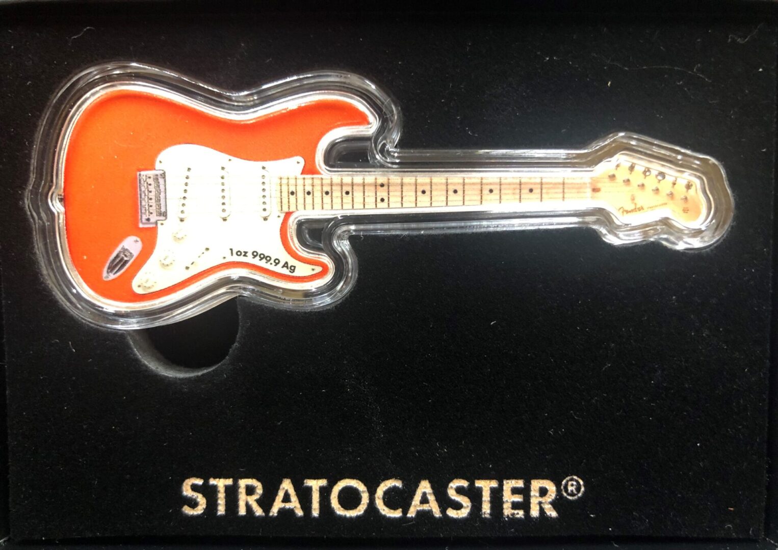 Stratocaster guitar in a black box.