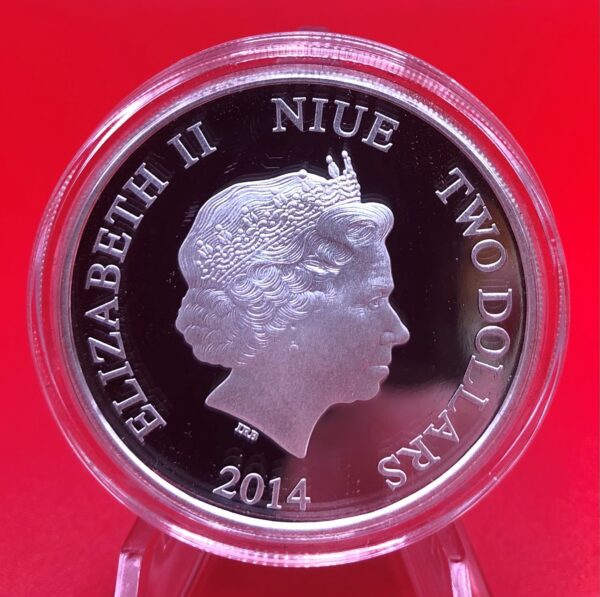 A silver coin with a portrait of queen elizabeth.